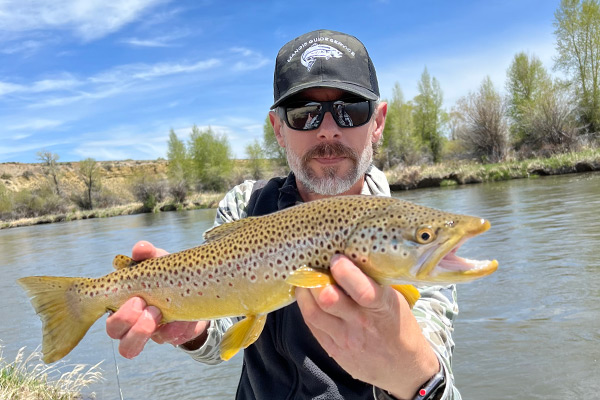Man with Brown Trout on Half-Day Jackson Hole Fly-Fishing Guide Trip